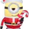 Gemmy Airblown Outdoor Inflatable Minion Stuart Licking Candy Cane, 42.13 In. X 24.41 In. X 32.28 In.